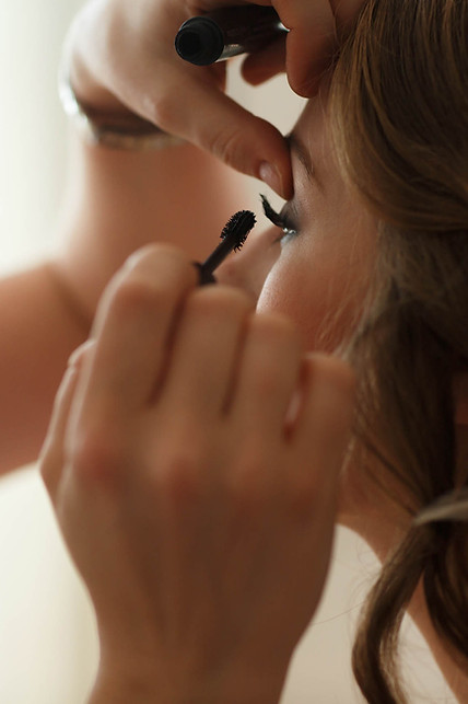 Makeup artist applying mascara
