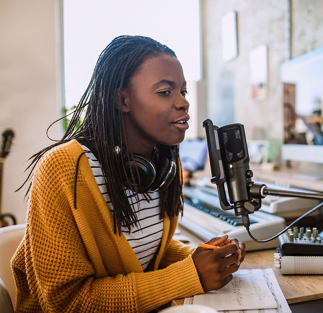 A young woman talking on the radio