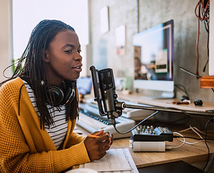 A young woman talking on the radio