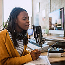 A young woman talking on the radio