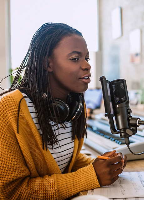 A young woman talking on the radio