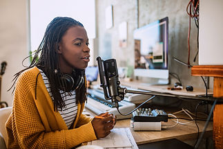 A young woman talking on the radio