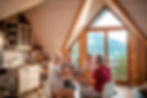 Friends enjoying breakfast in a cozy mountain cabin