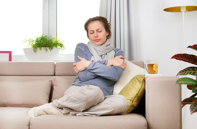 Sick woman resting on a sofa