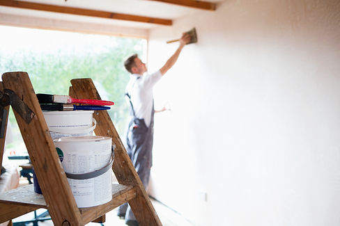 Man painting a wall
