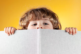Child Behind Book
