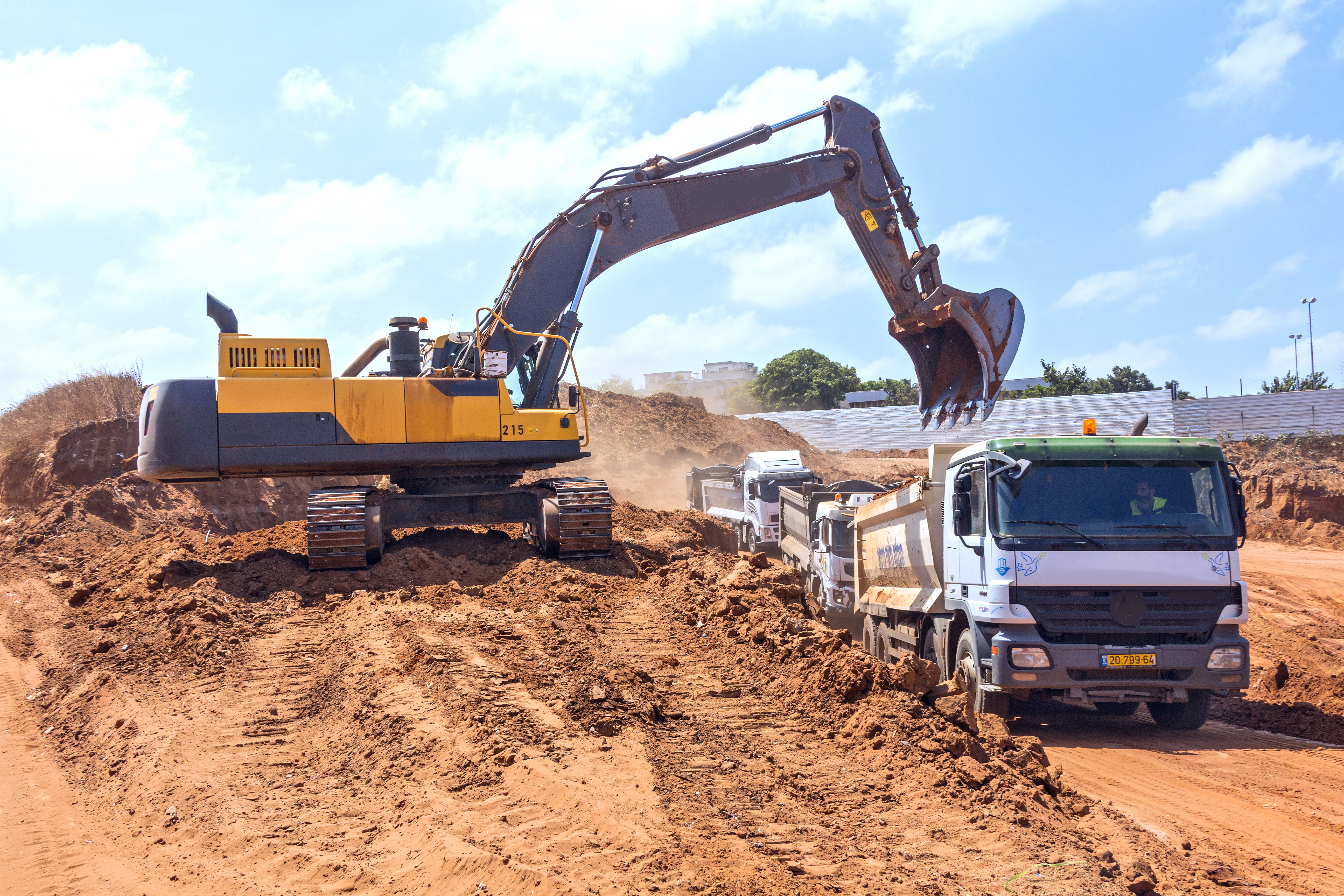 Excavator And Dump Trucks