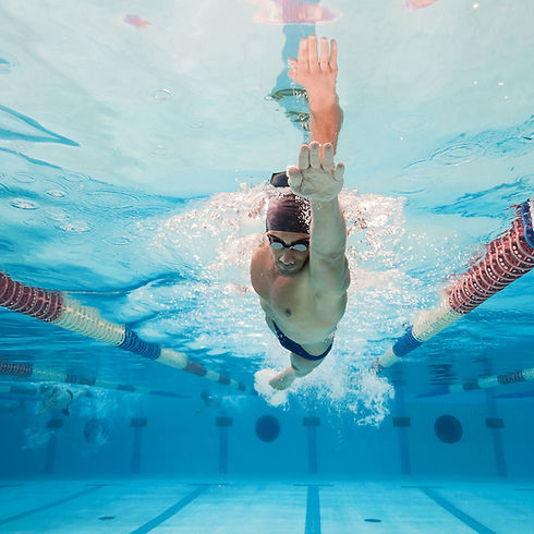 Underwater view of man swimming laps