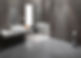 A bathroom featuring sleek grey tiles and a shower with glass doors