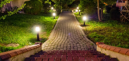 Houses and garden in the city at midnight