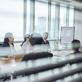 Group Of Business People Sitting Around Table