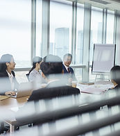 Group Of Business People Sitting Around Table