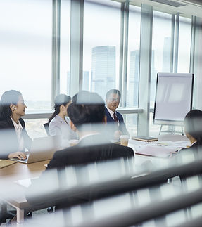 Group Of Business People Sitting Around Table
