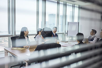 Group Of Business People Sitting Around Table