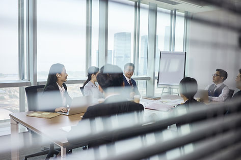 Group Of Business People Sitting Around Table