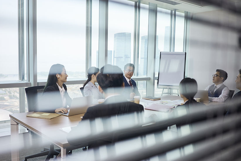 Group Of Business People Sitting Around Table