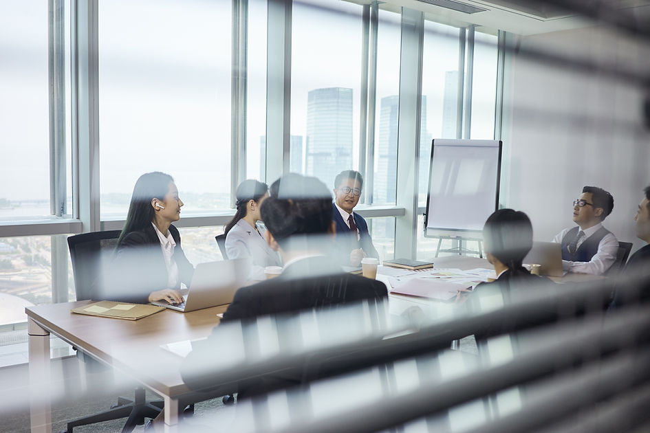 Group Of Business People Sitting Around Table