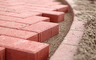 close-up image of red blocks of a pavement which is under construction