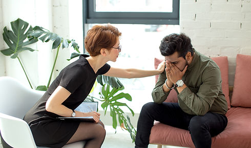 A woman comforting a man