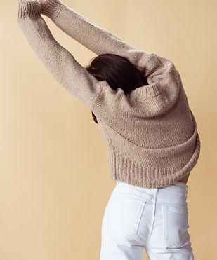 Stretching in Sweater
