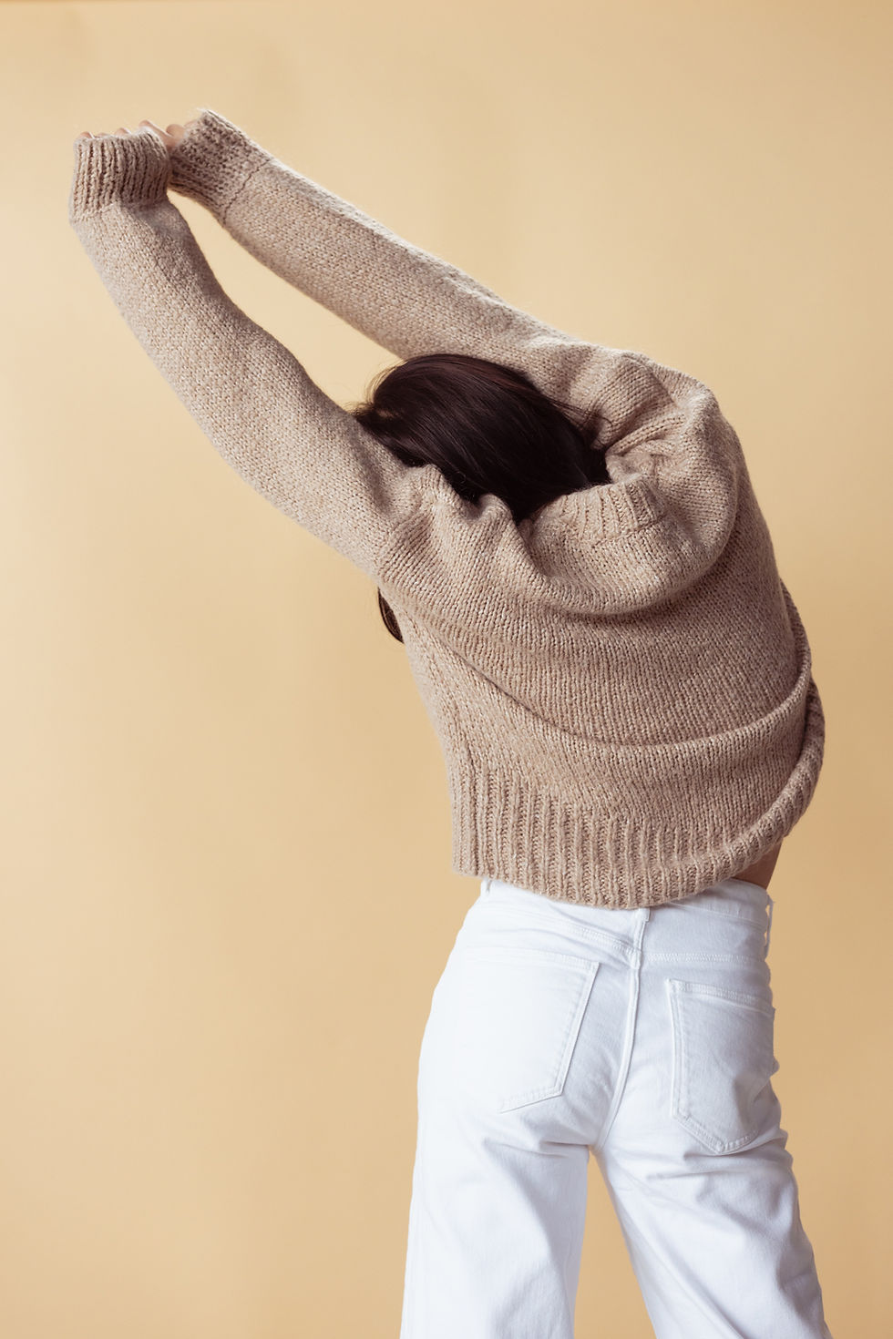 Stretching in Sweater