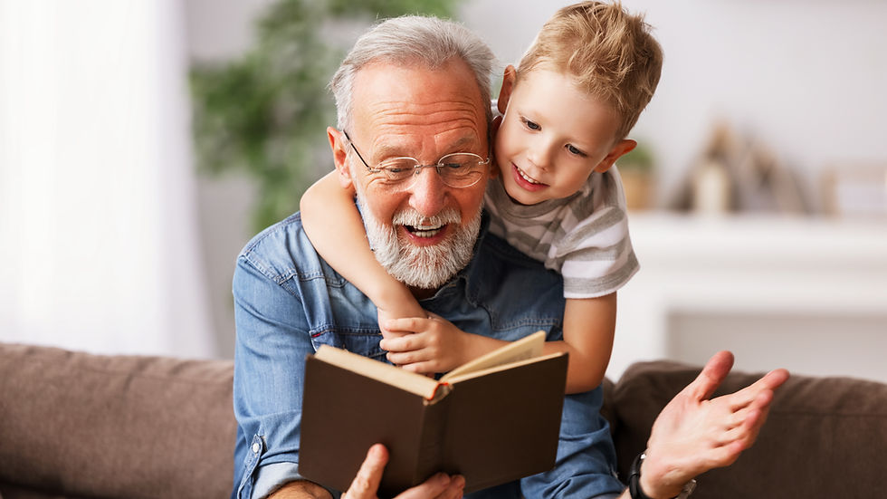A grandfather reading a story to a kid