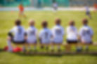 Young Footballers on Bench