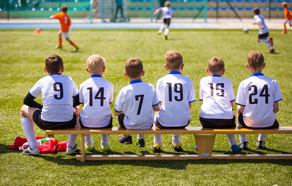 Young Footballers on Bench
