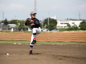 Youth pitcher in windup.