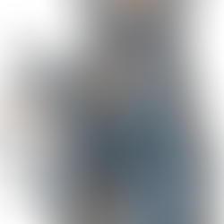 A bear wearing a party hat holding a party garland