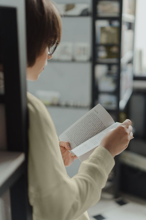 Leaning against a Bookshelf