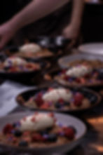 Cream and Berries Dessert Close-up of beautifully arranged food platters, showcasing the culinary artistry of Select Service Catering.