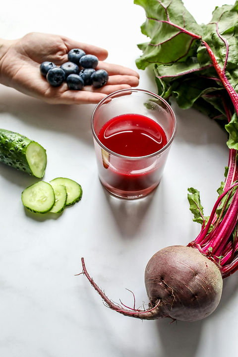 Hand with Blueberries and Juice