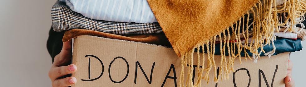 Woman holding a box of clothes for donation