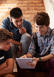 Students Sitting on Staircase