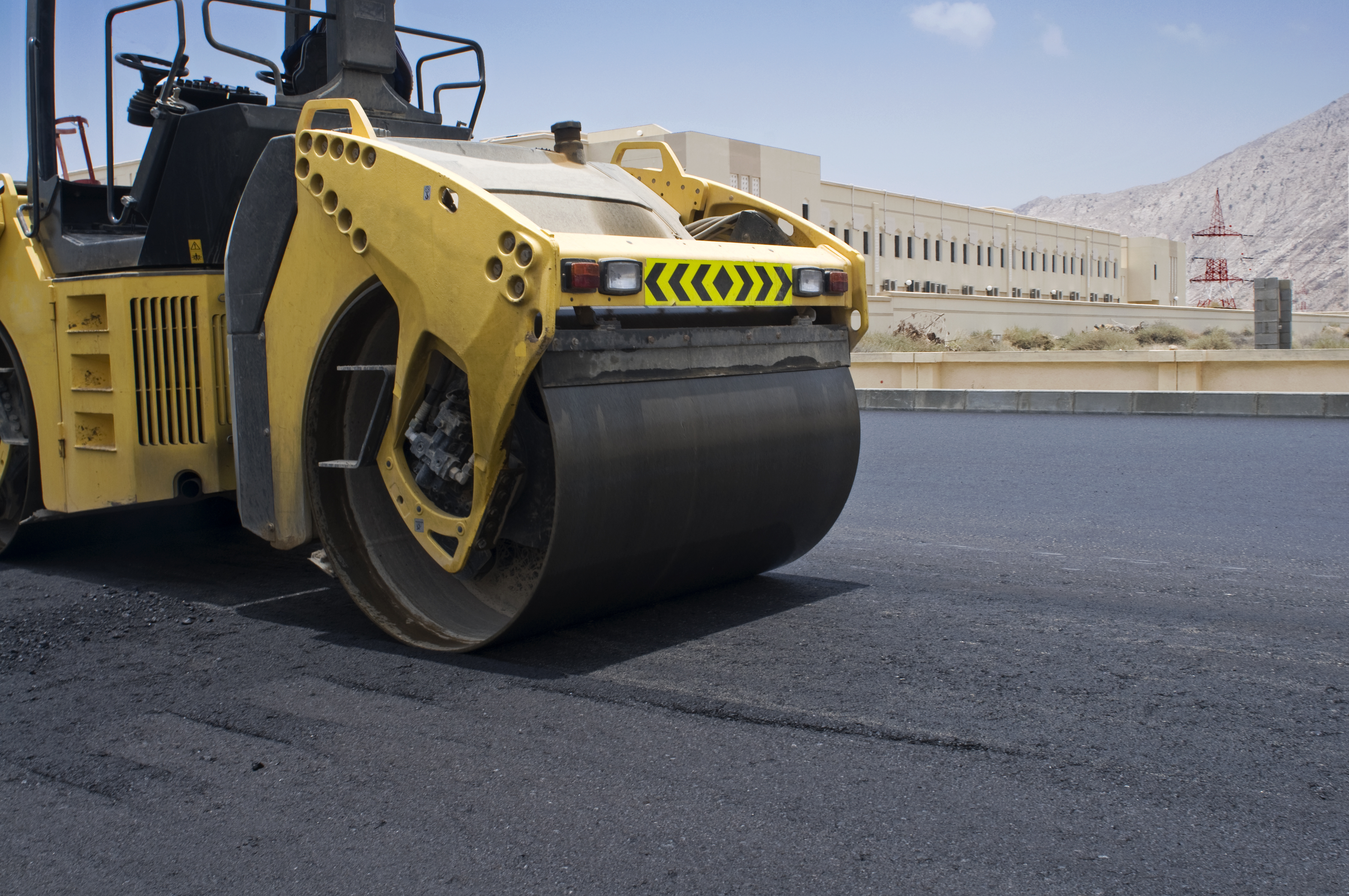 Road roller surfacing the road