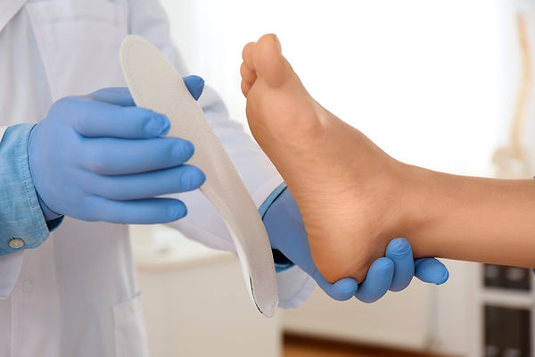 orthotics insole being placed on foot