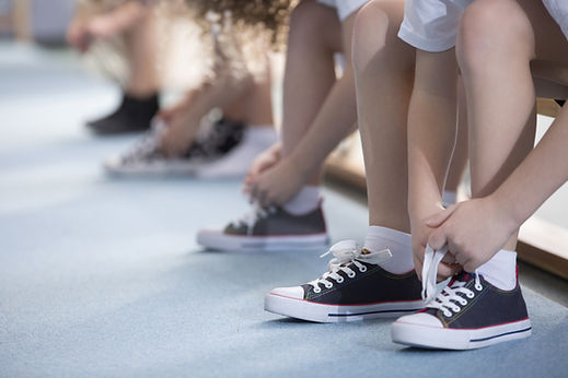 Kids tying shoelaces
