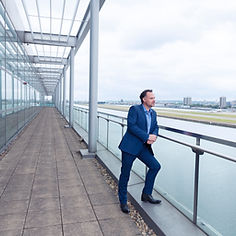 Businessman standing on balcony