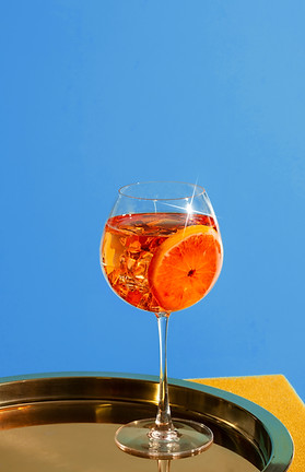 Orange signature cocktail showcasing The Traveling Toast mobile bartending services