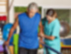Senior man doing running training with physiotherapist in nursing home