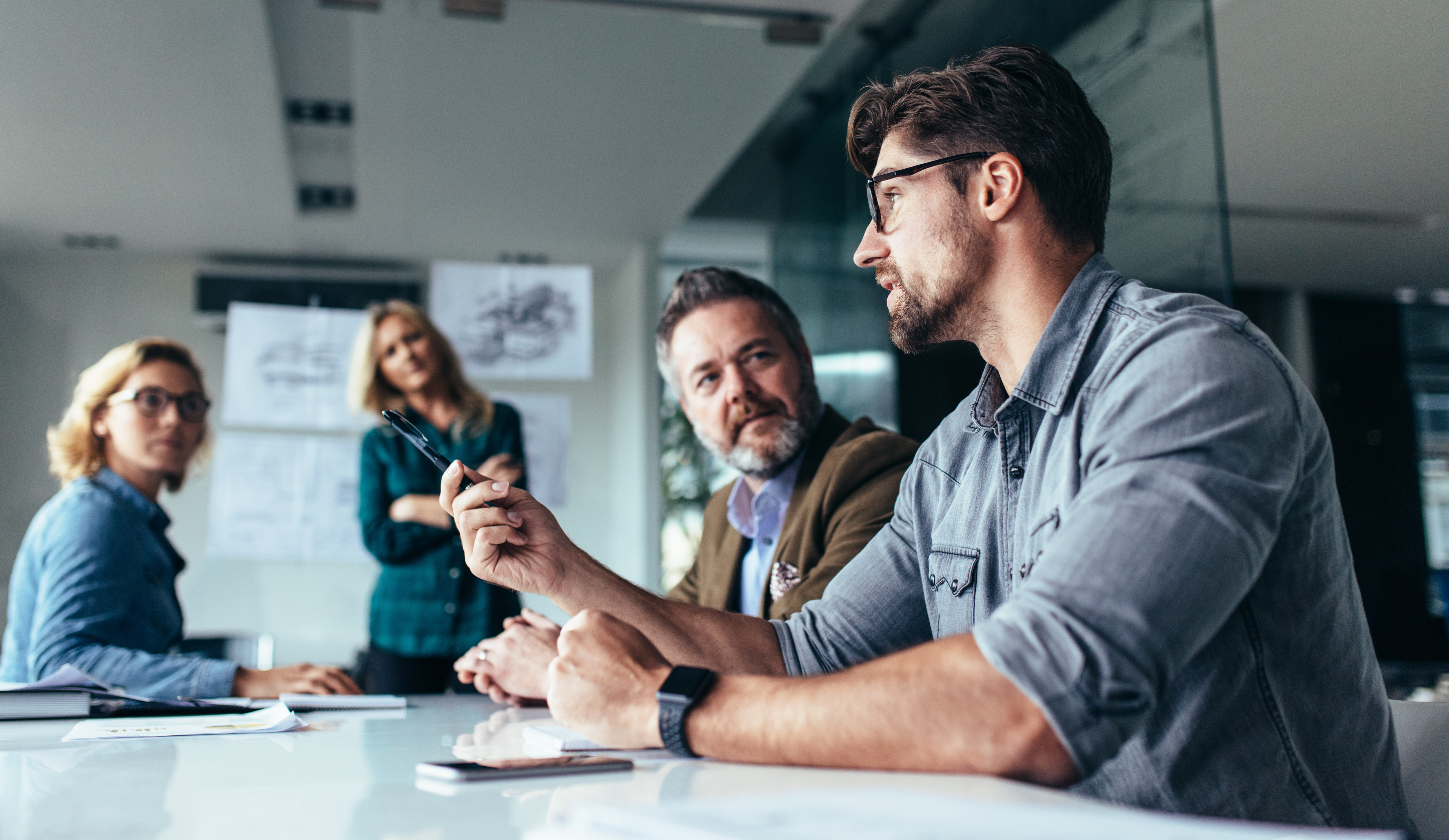 A project manager discussing the key steps in outsourcing web development