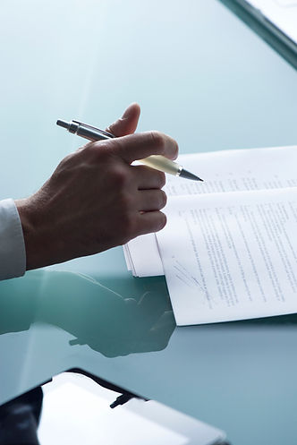 Businessman reviewing document, cropped