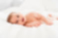 Smiling baby on bed