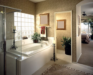 Luxurious bathroom with a white tub glass shower