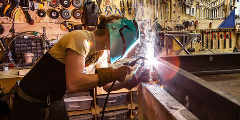 Metalworker using Welding Machine