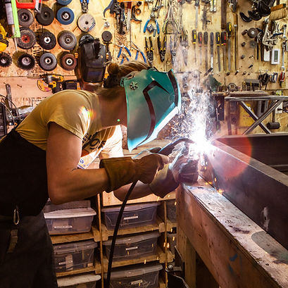 Metalworker using Welding Machine