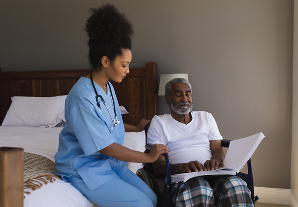 Caregiver Assisting Patient