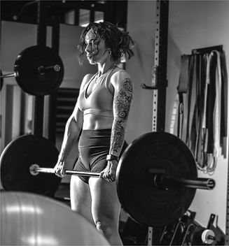 Woman Lifting Heavy Barbell