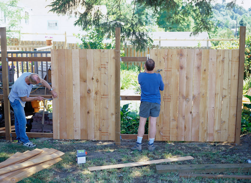 Carpenters building a fence